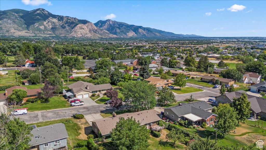 Aerial perspective of suburban area featuring a mountain backdrop