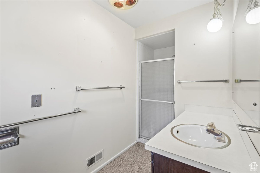 Bathroom with vanity and an enclosed shower