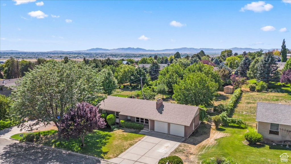 Aerial view of property and surrounding area with mountains