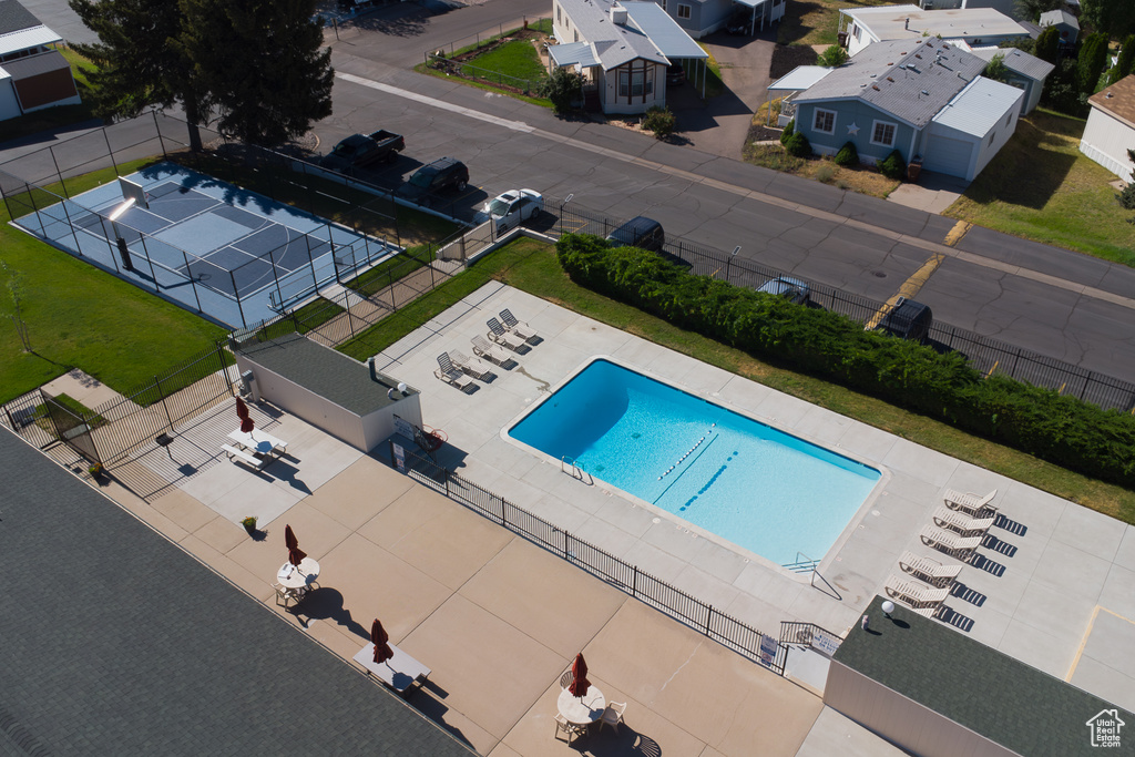 Aerial perspective of suburban area featuring a pool area
