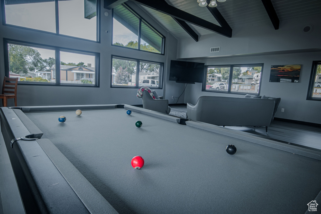 Rec room with beam ceiling, healthy amount of natural light, billiards, and high vaulted ceiling