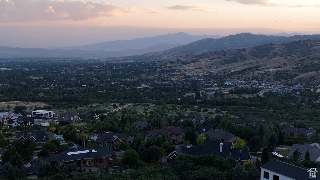 Aerial view of residential area featuring mountains