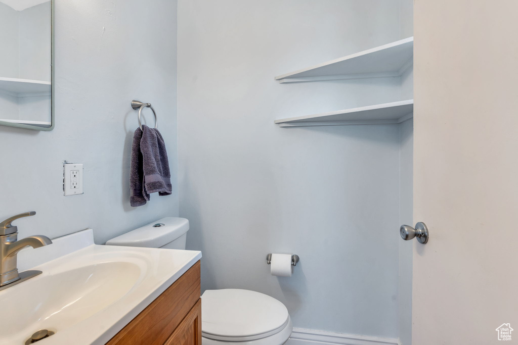Bathroom featuring toilet and vanity