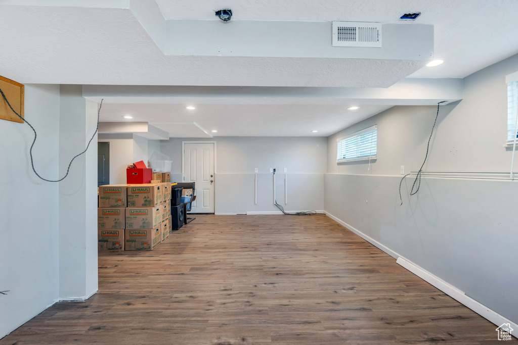 Basement featuring wood finished floors and recessed lighting