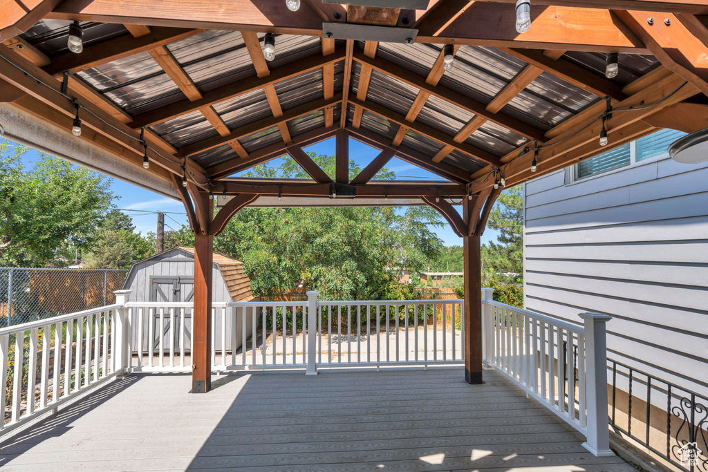 Wooden terrace with a shed and a gazebo