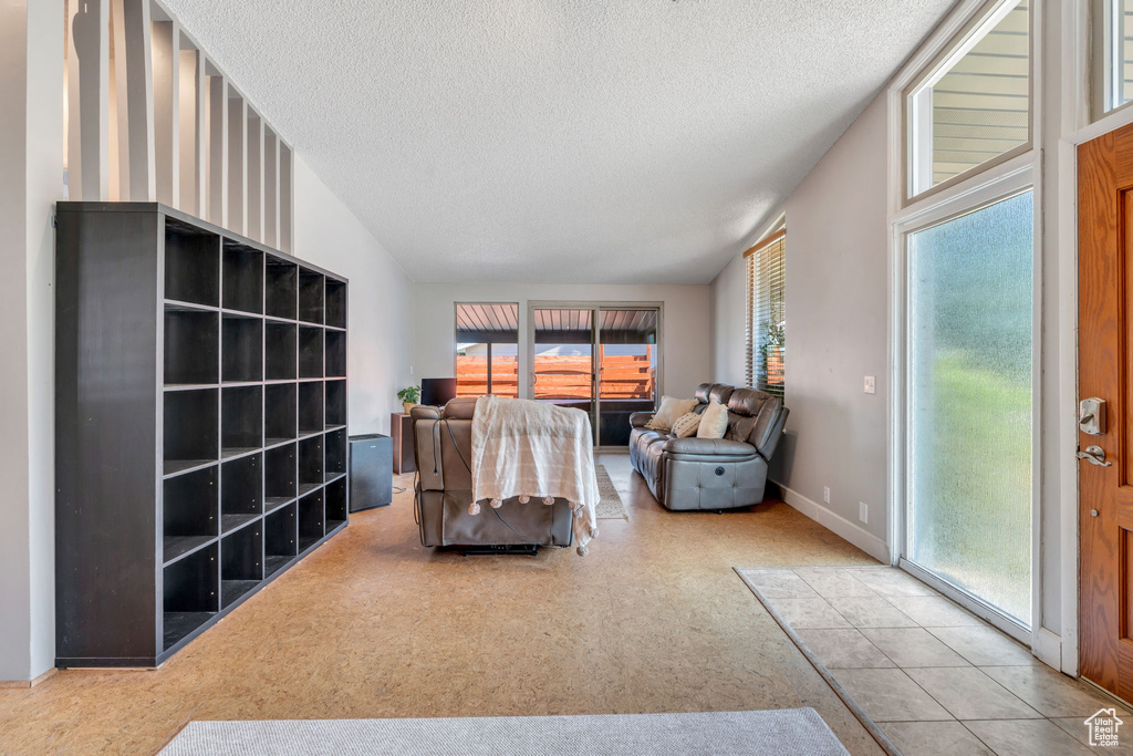 Living area featuring a textured ceiling