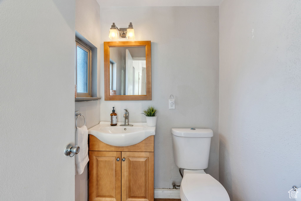 Half bath with toilet and vanity