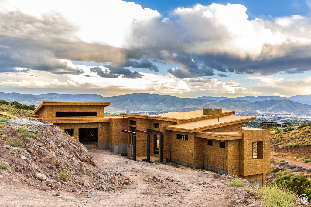 Property in mid-construction featuring a mountain view