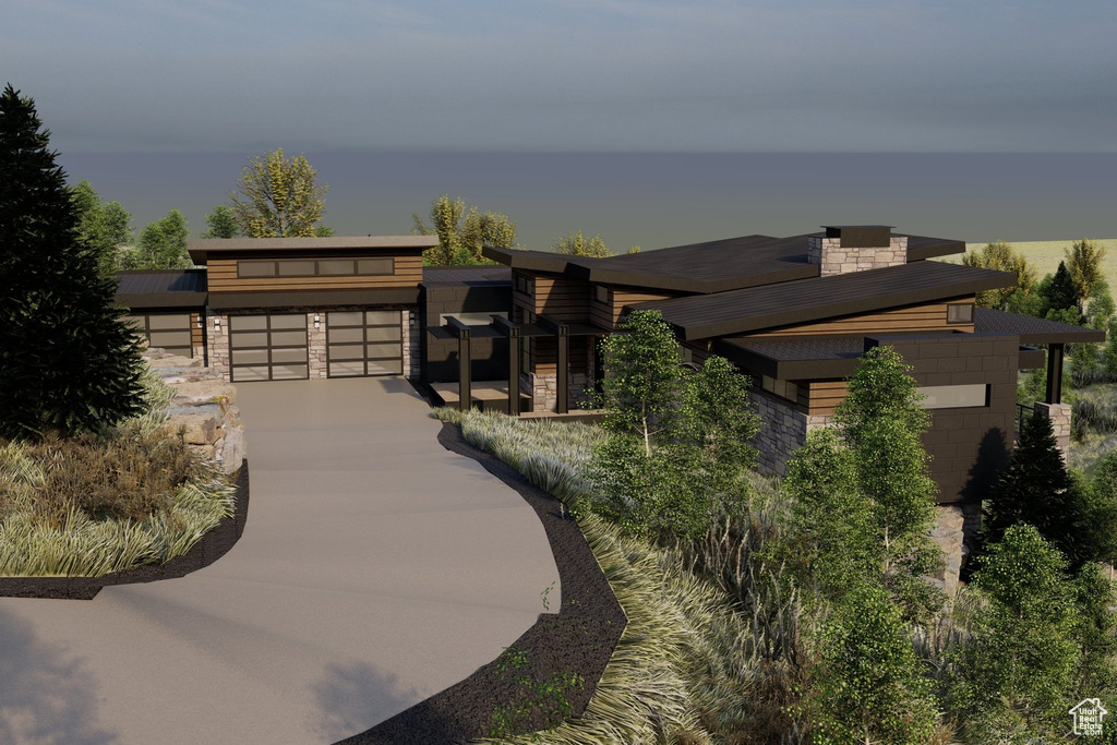 Contemporary house featuring concrete driveway, a garage, stone siding, and a chimney