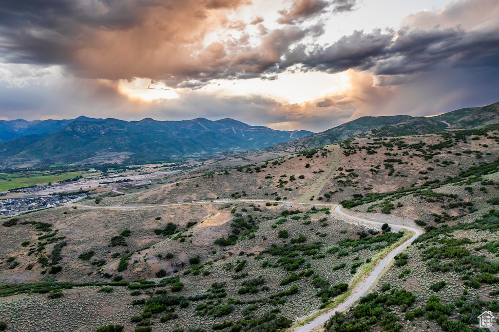 View of mountain backdrop featuring rural landscape