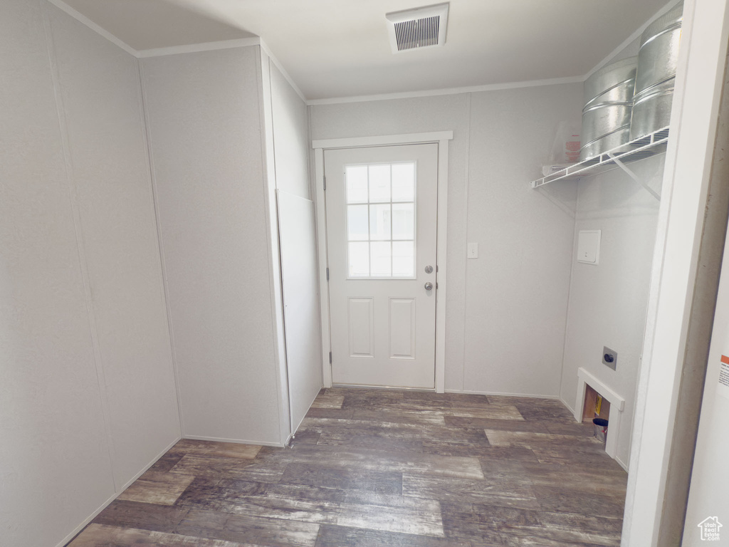 Laundry room with electric dryer hookup, wood finished floors, and crown molding