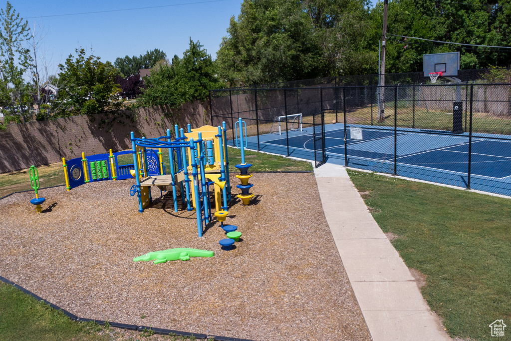 Community jungle gym with community basketball court