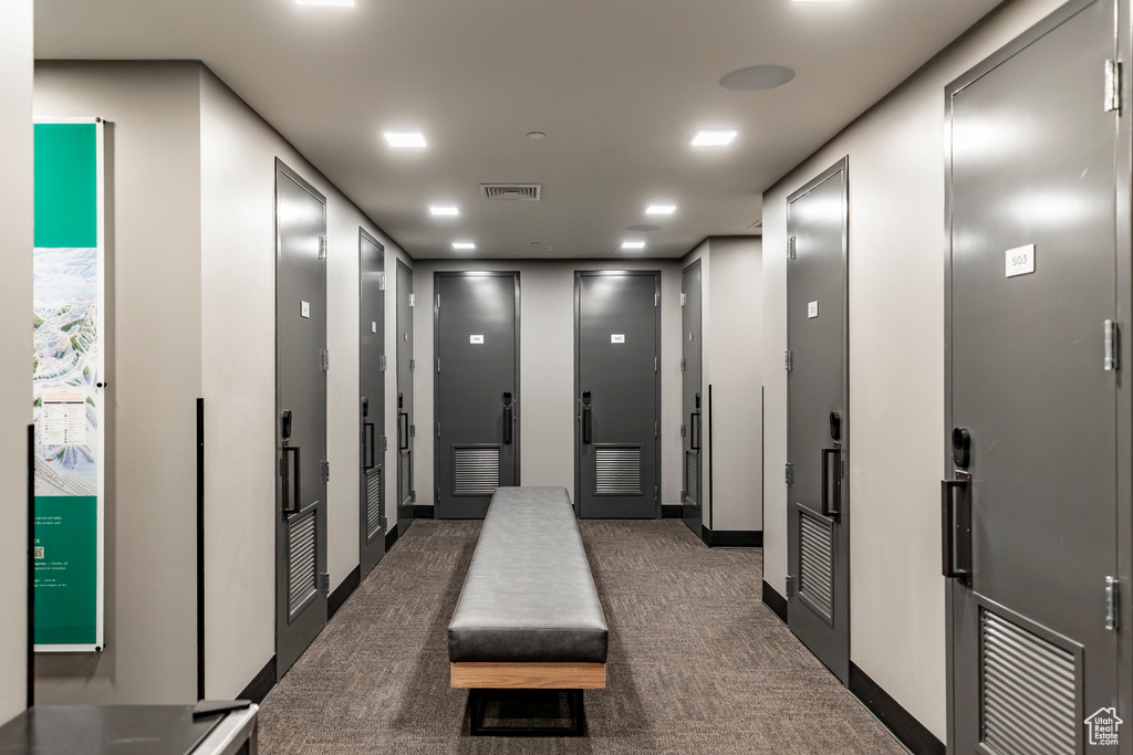 Hallway featuring carpet