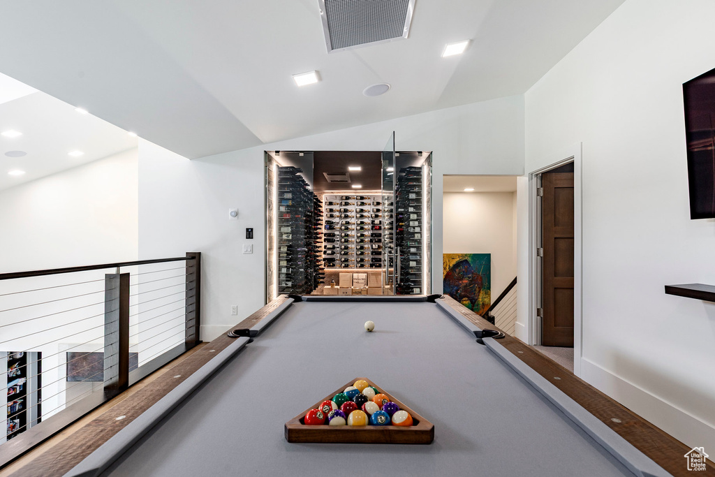 Playroom featuring vaulted ceiling and pool table