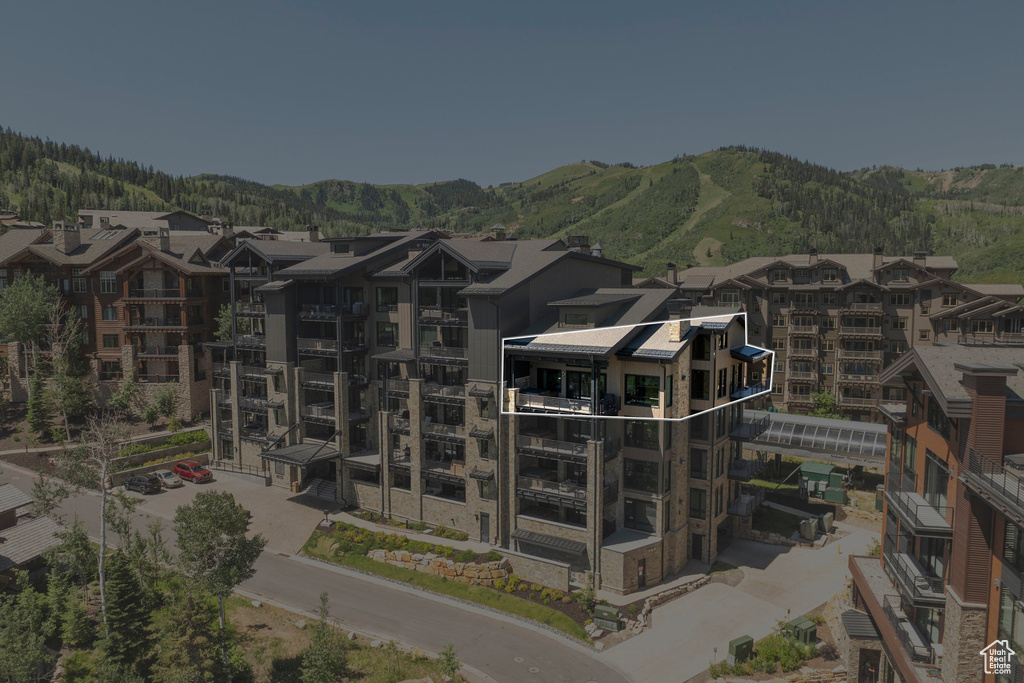 Aerial view of mountains and apartment complex / building