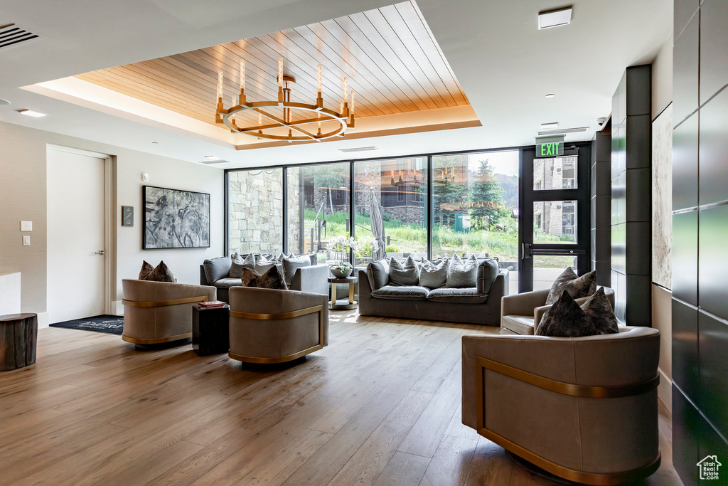 Community lobby with a wall of windows and wooden ceiling