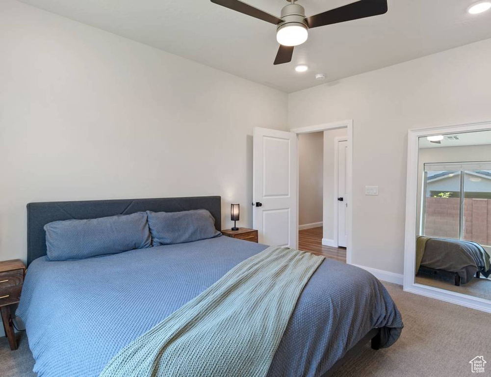 Bedroom with carpet, ceiling fan, and recessed lighting