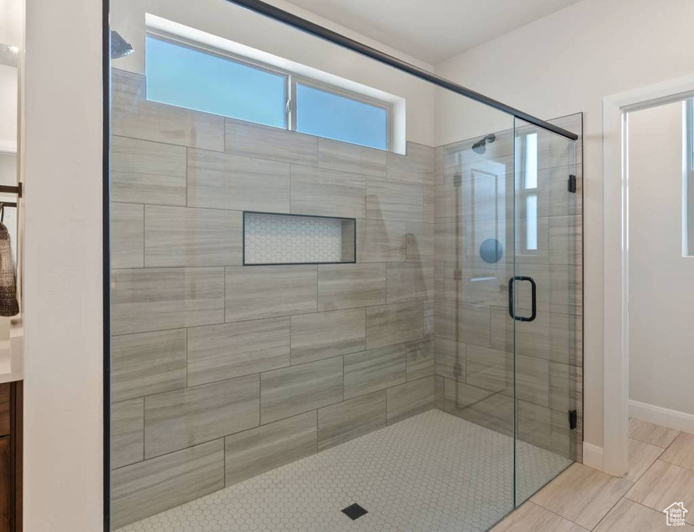 Full bath with a stall shower and vanity
