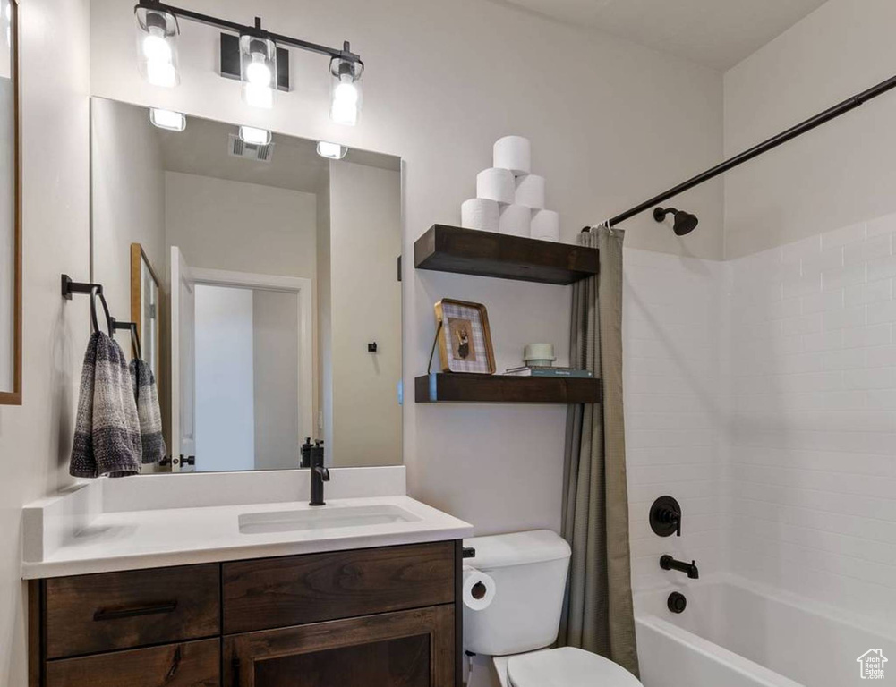 Full bath featuring shower / tub combo with curtain and vanity