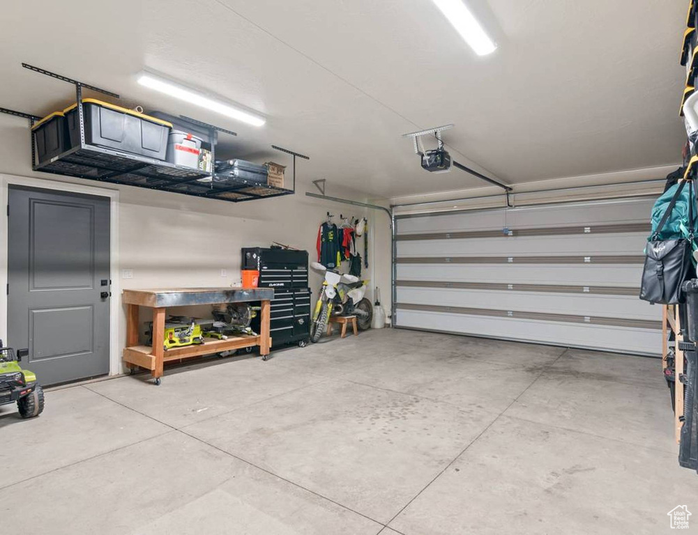 Garage featuring a garage door opener