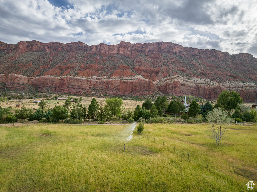 View of mountain backdrop with rural landscape