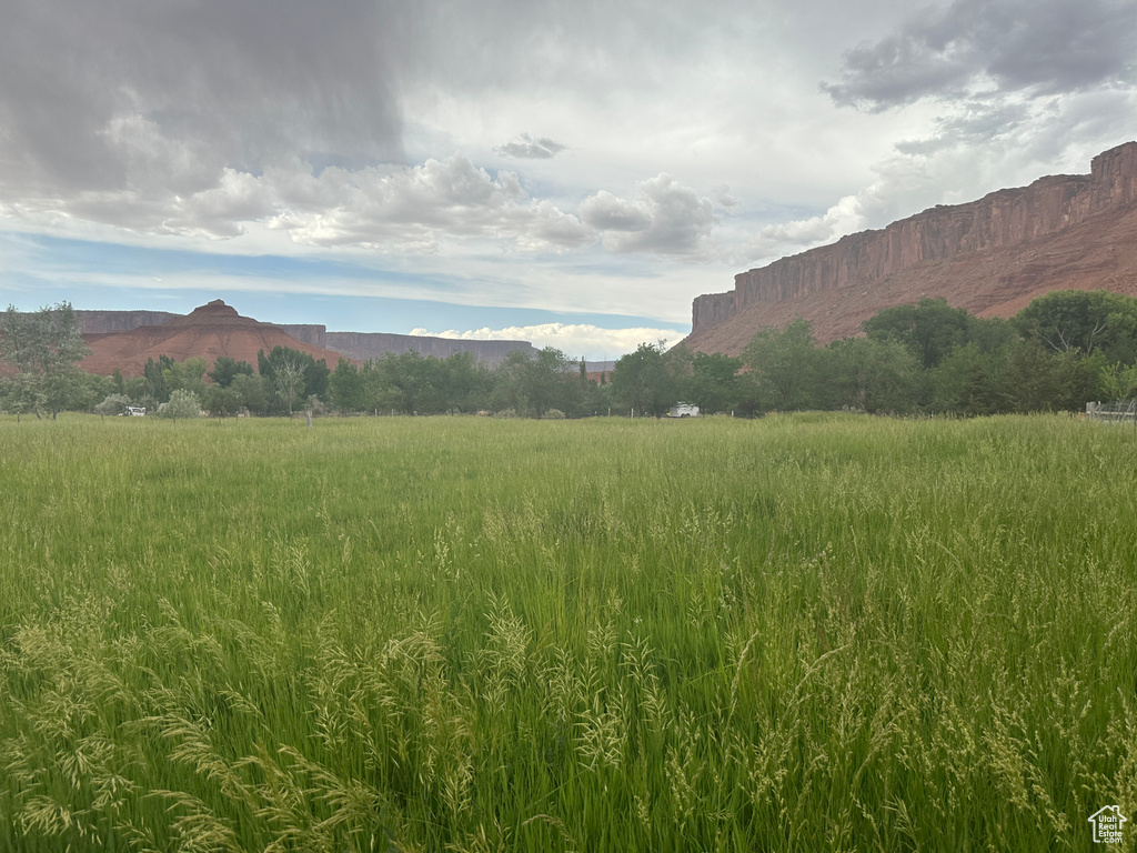 View of mountain backdrop featuring rural landscape