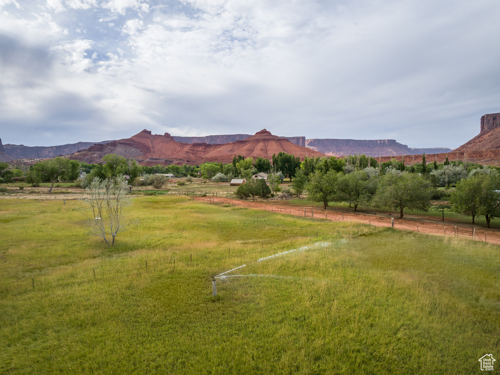 View of mountain backdrop with rural landscape