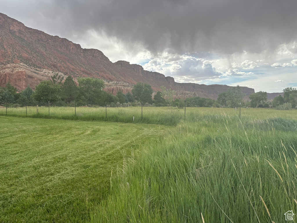 View of mountain backdrop featuring rural landscape