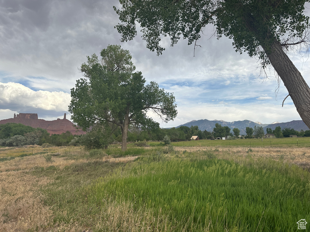 View of mountain background featuring rural landscape