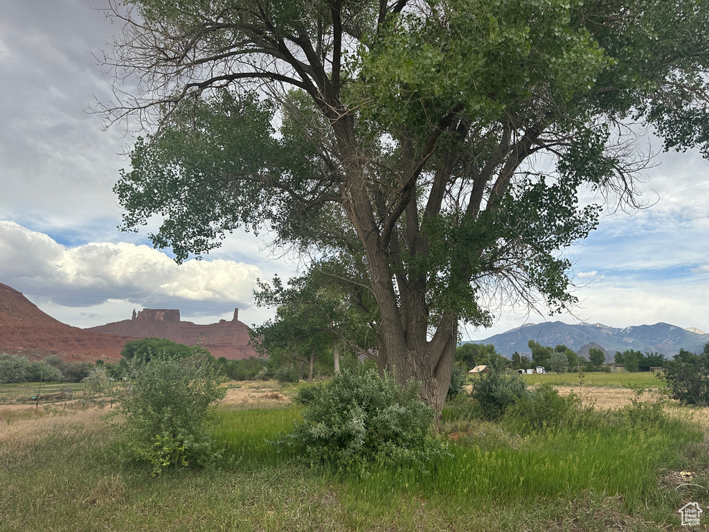 View of mountain backdrop featuring rural landscape