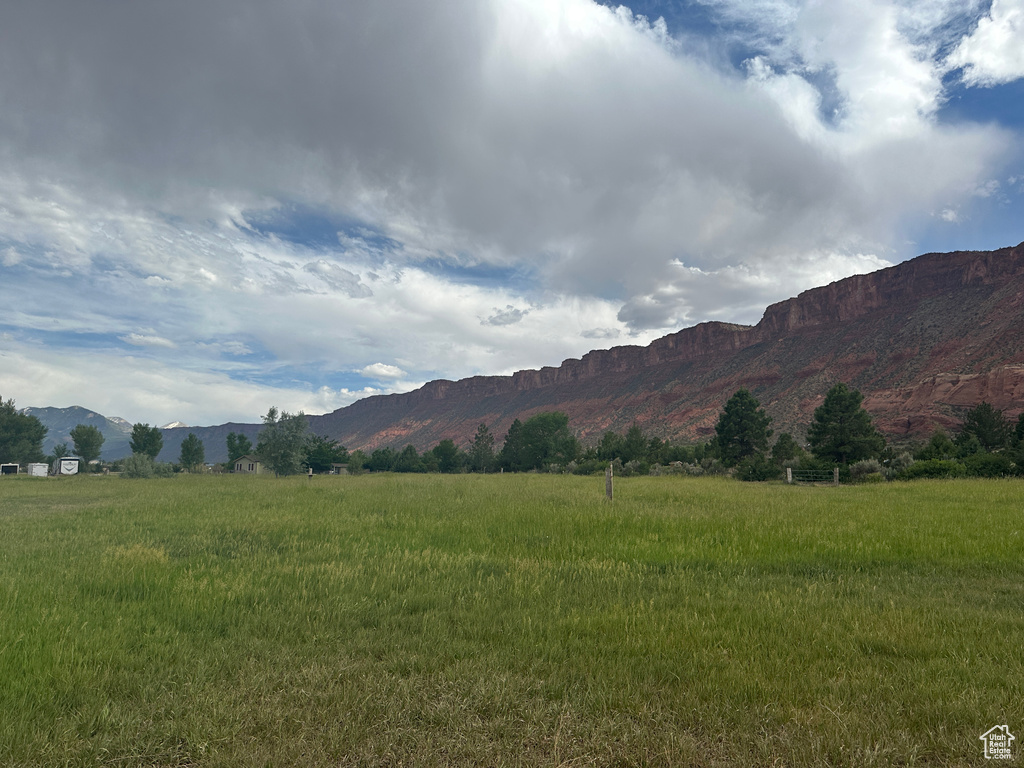 View of mountain background featuring rural landscape