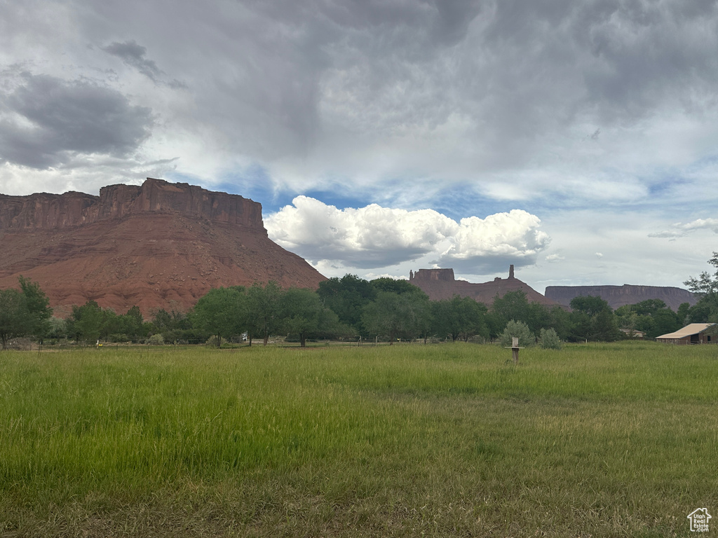 View of mountain background featuring rural landscape