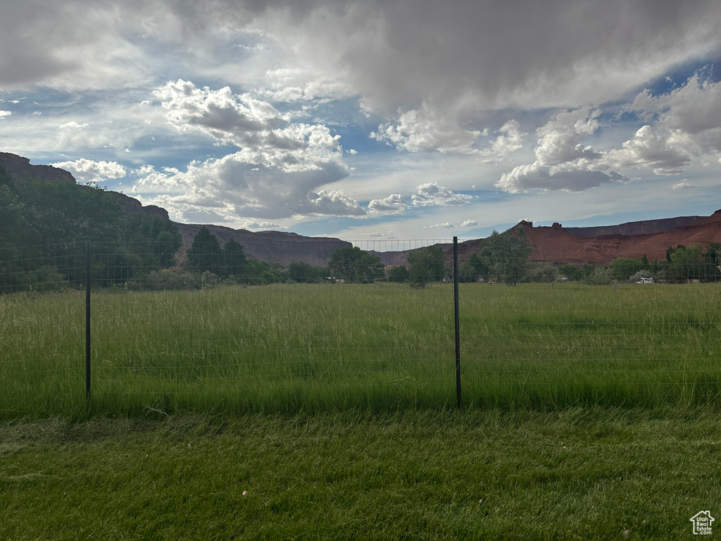 View of mountain background featuring rural landscape