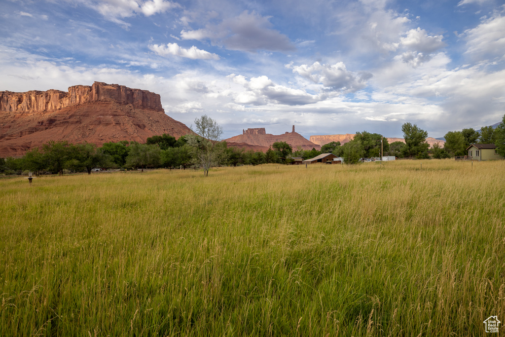 View of mountain backdrop featuring rural landscape