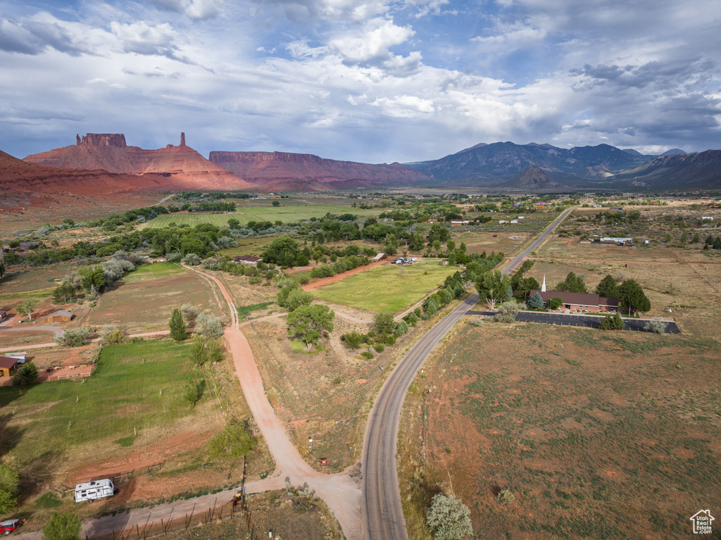 View of property location featuring a mountainous background and rural landscape