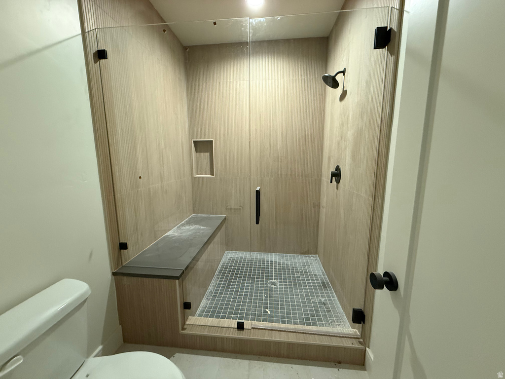 Bathroom with a stall shower and elevator