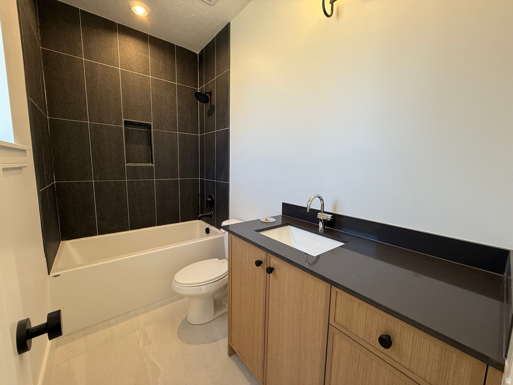 Bathroom featuring vanity and shower / bath combination