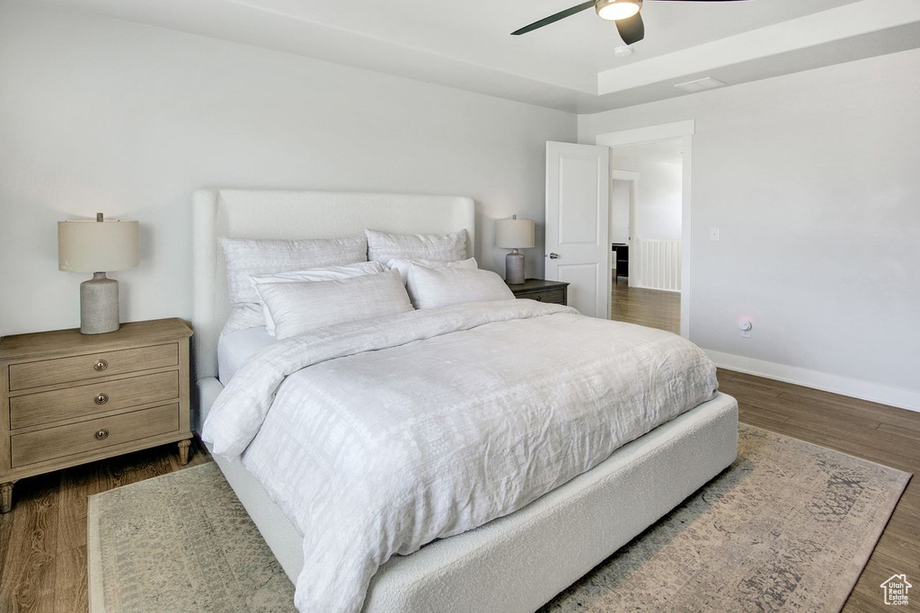 Bedroom featuring wood finished floors and ceiling fan