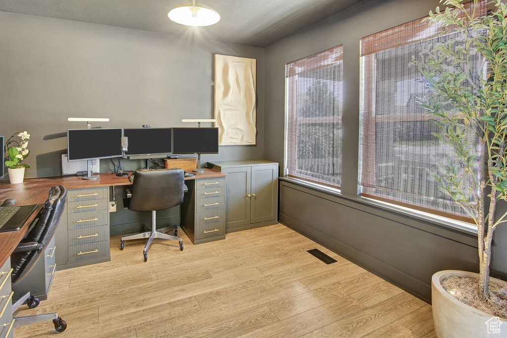 Home office featuring light wood finished floors