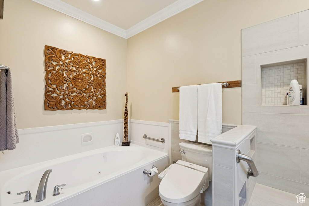 Full bath with ornamental molding and a tub with jets