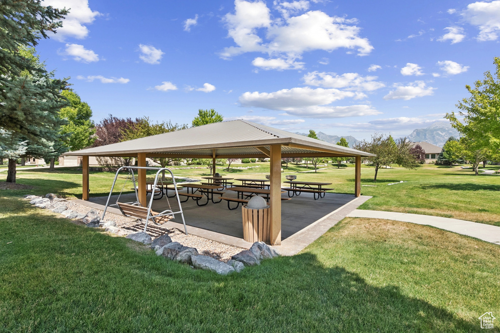 View of property\'s community featuring a gazebo, a yard, and a mountain view