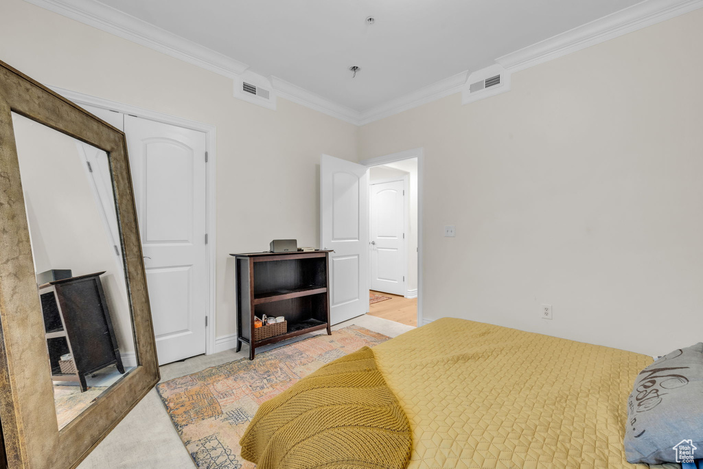Bedroom featuring crown molding