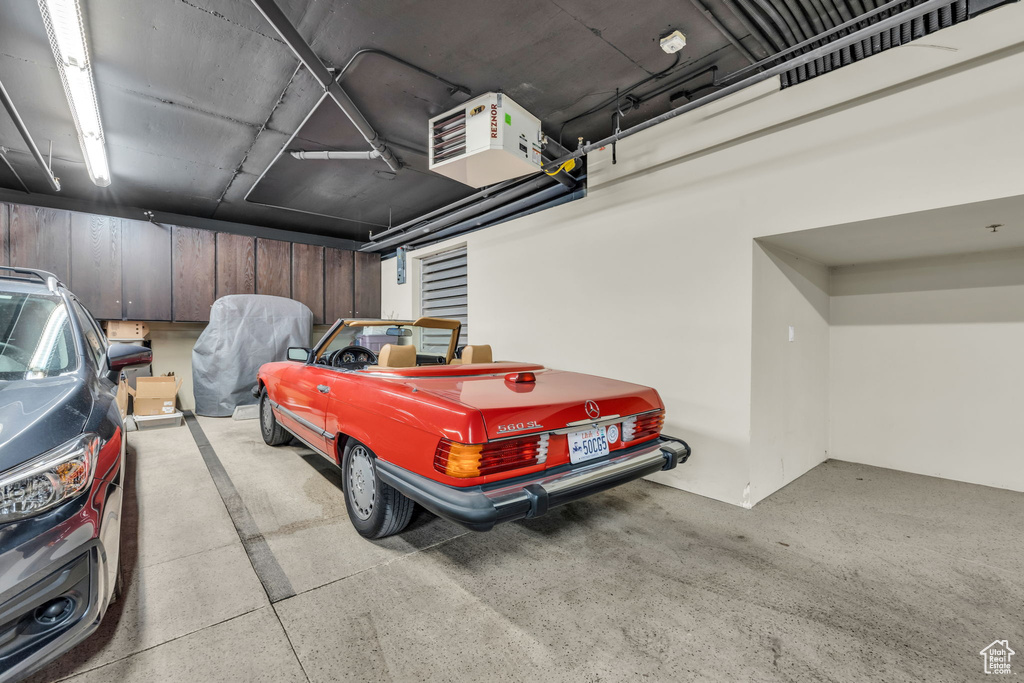 Garage featuring a heating unit