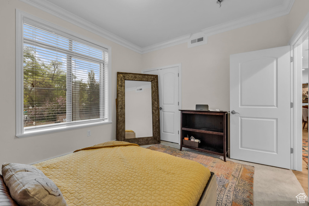 Bedroom featuring crown molding