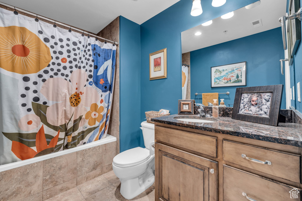 Full bathroom with vanity and shower / bathtub combination with curtain