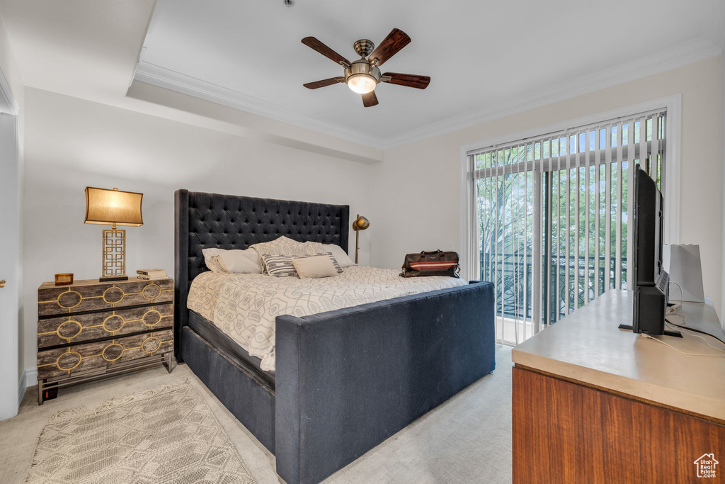Bedroom with light colored carpet, access to outside, ornamental molding, and ceiling fan