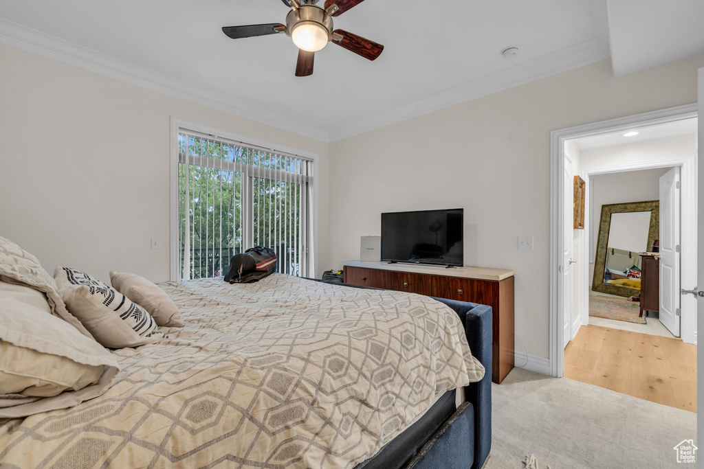 Bedroom with access to outside, crown molding, and ceiling fan