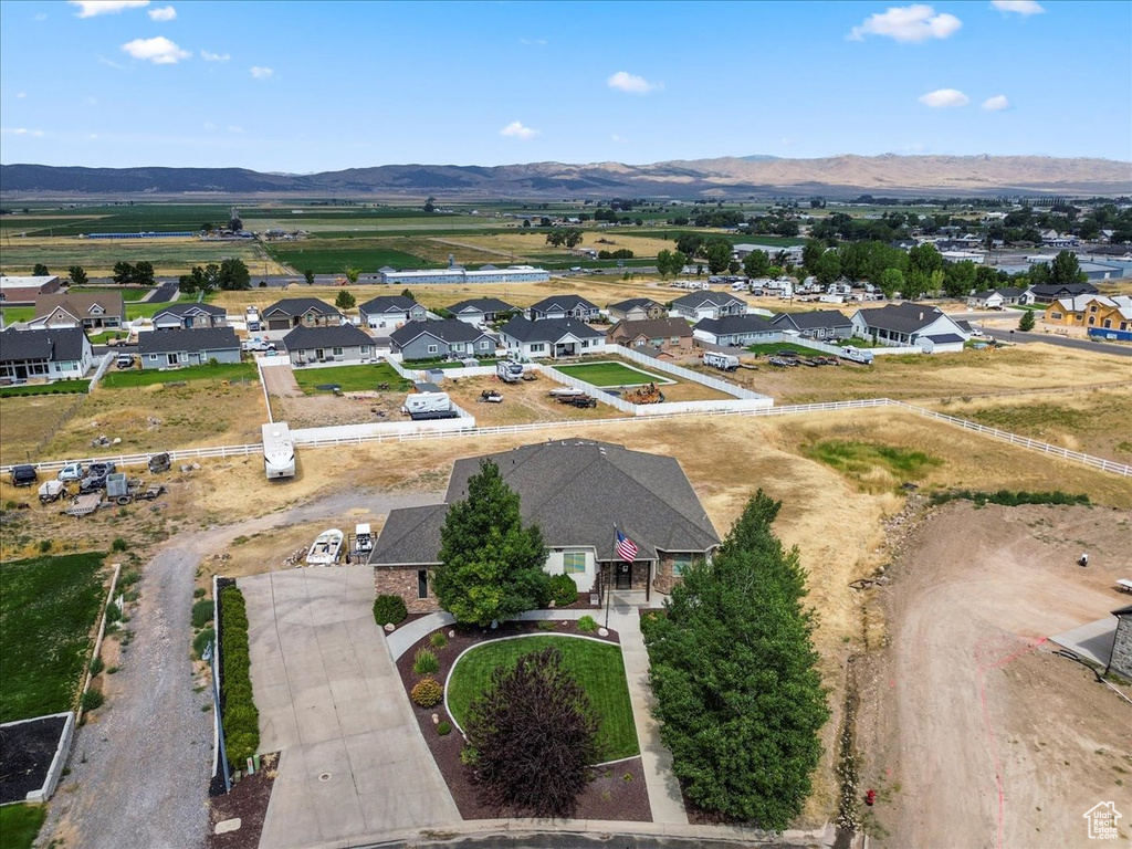 Aerial view of residential area featuring a mountainous background