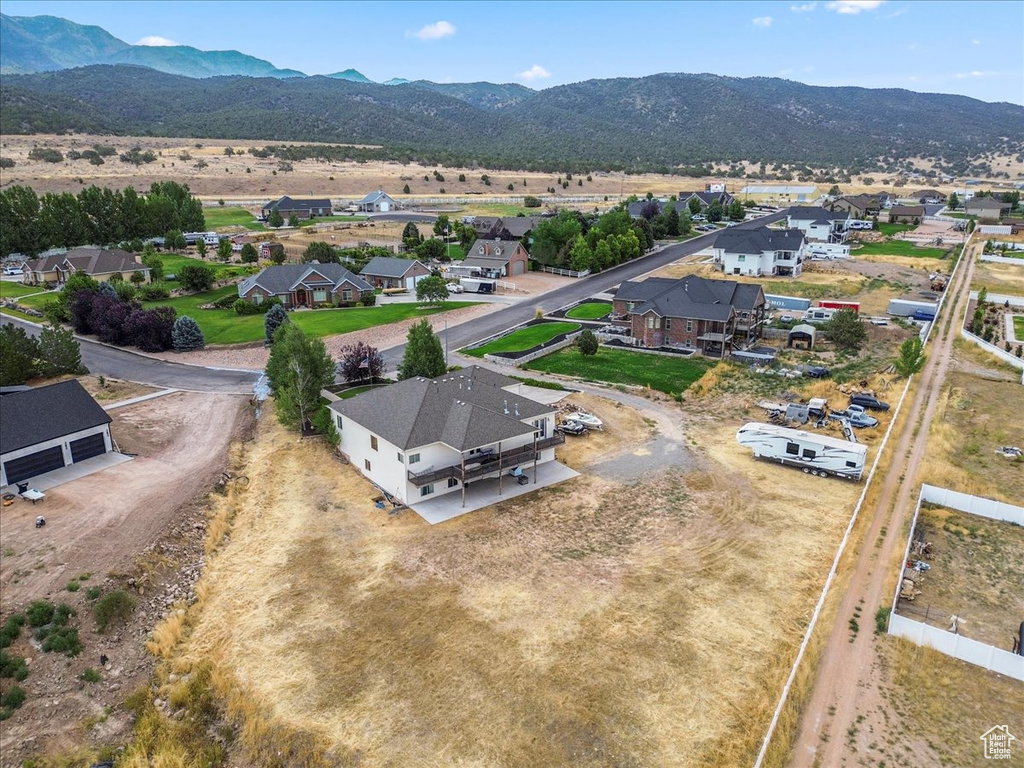 Aerial perspective of suburban area featuring a mountainous background