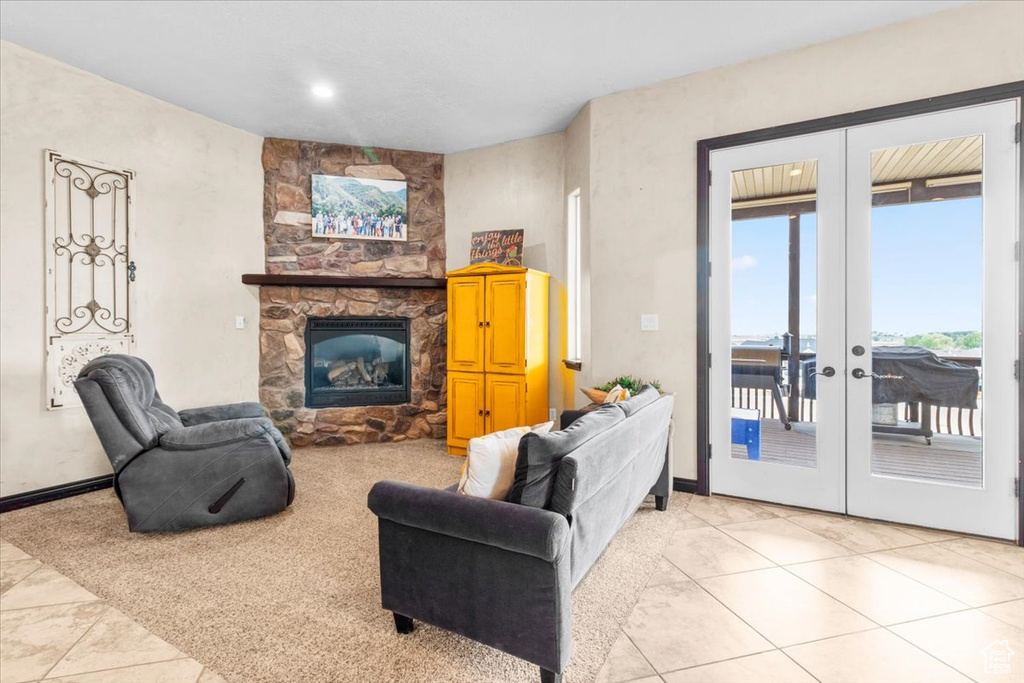 Living room with french doors and a fireplace